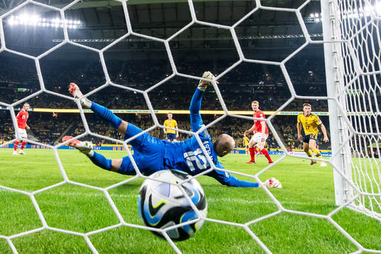 Emil Holm of Sweden scores the 1-3 goal against goalkeeper