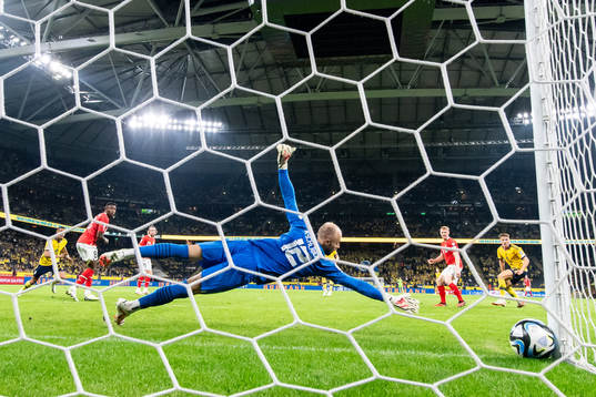 Emil Holm of Sweden scores the 1-3 goal against goalkeeper