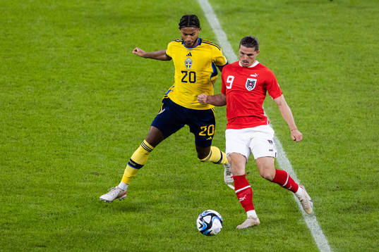Jens-Lys Michel Cajuste of Sweden and Marcel Sabitzer of