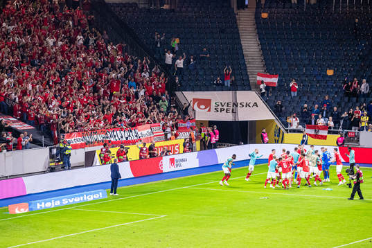 Players of Austria celebrates with supporters