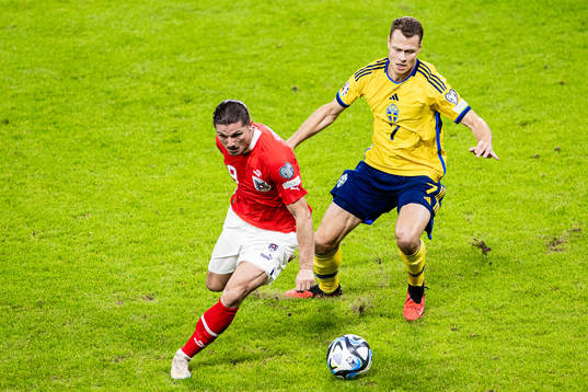 Marcel Sabitzer of Austria and Viktor Claesson of Sweden