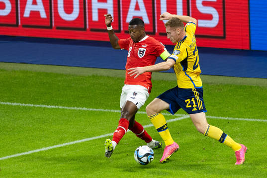 David Alaba of Austria and Dejan Kulusevski of Sweden