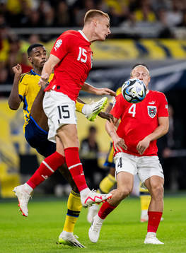 Alexander Isak of Sweden and Philipp Lienhart of Austria