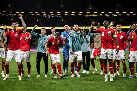 David Alaba of Austria celebrate with teammates