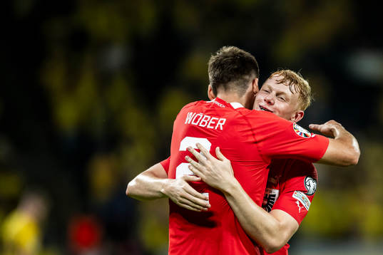 Maximilian Wöber and Nicolas Seiwald of Austria celebrate