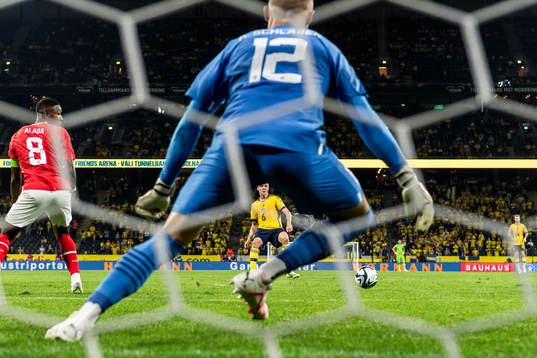 Emil Holm of Sweden scores the 1-3 goal behind David Alaba