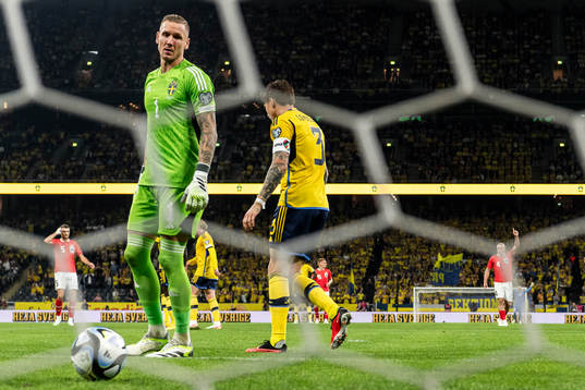 Goalkeeper Robin Olsen and Victor Nilsson Lindelöf of
