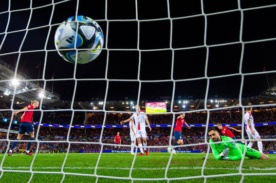 Martin Ødegaard of Norway scores 2-0 behind goalkeeper
