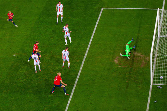 Martin Ødegaard of Norway scores 2-0 behind goalkeeper