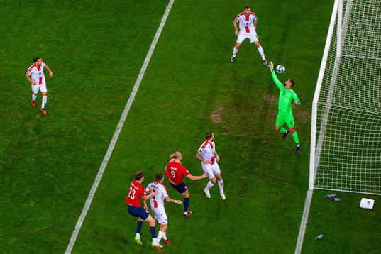 Erling Braut Haaland of Norway scores 1-0 behind goalkeeper
