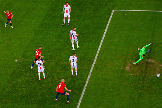 Martin Ødegaard of Norway scores 2-0 behind goalkeeper