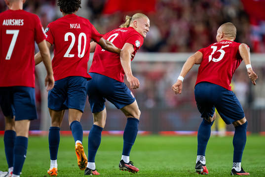 Erling Braut Haaland of Norway celebrates with teammate Leo