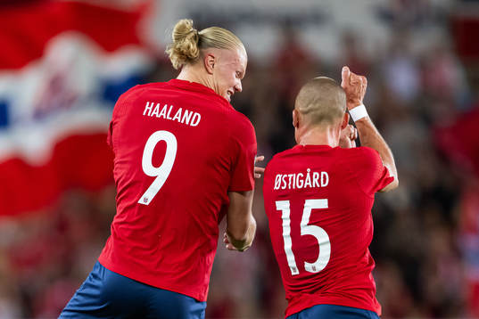 Erling Braut Haaland of Norway celebrates with teammate Leo