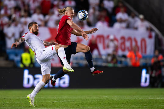 Guram Kashia of Georgia and Erling Braut Haaland of Norway