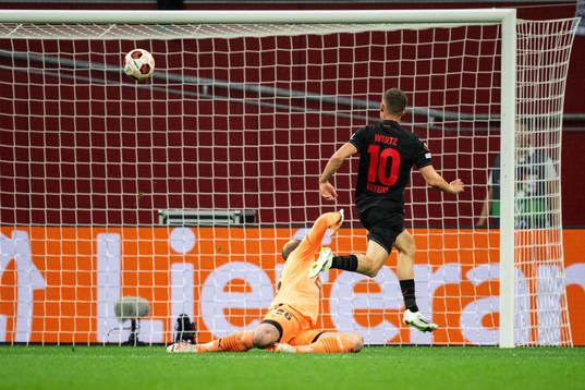 Florian Wirtz of Bayer Leverkusen scores 1-0 behind