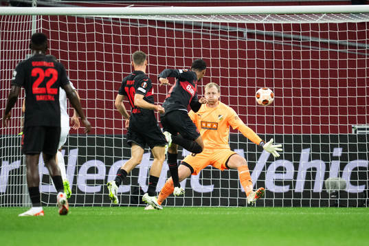 Amine Adli of Bayer Leverkusen scores 2-0 behind goalkeeper