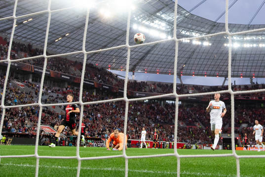 Florian Wirtz of Bayer Leverkusen scores 1-0 behind