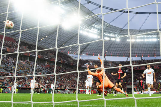 Amine Adli of Bayer Leverkusen scores 2-0 behind goalkeeper