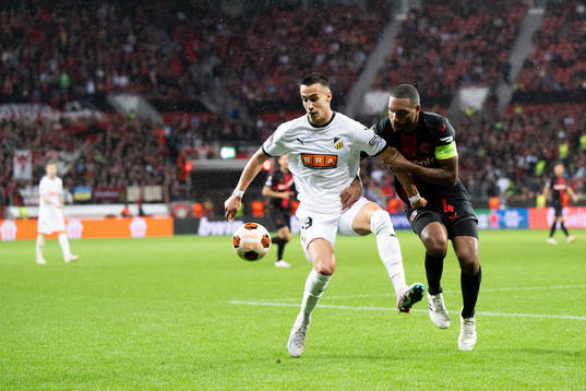 Srdjan Hrstic of Häcken and Jonathan Tah of Bayer