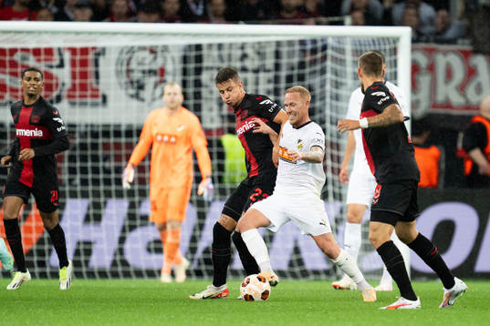 Adam Hložek of Bayer Leverkusen and Mikkel Rygaard Jensen