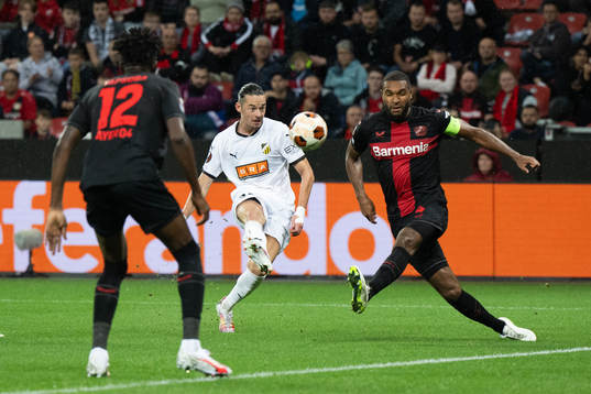 Amor Layouni of Häcken and Jonathan Tah of Bayer Leverkusen