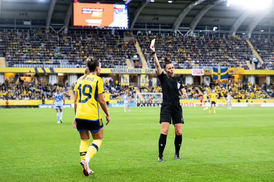 Johanna Rytting Kaneryd of Sweden receives a yellow card