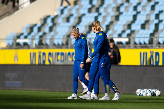 Jonna Andersson and goalkeeper Tove Enblom of Sweden