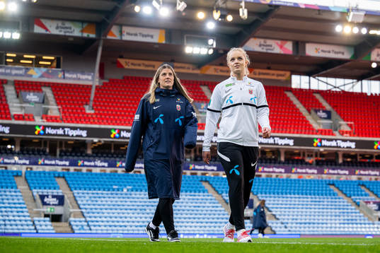 Maren Mjelde and goalkeeper Guro Pettersen of Norway