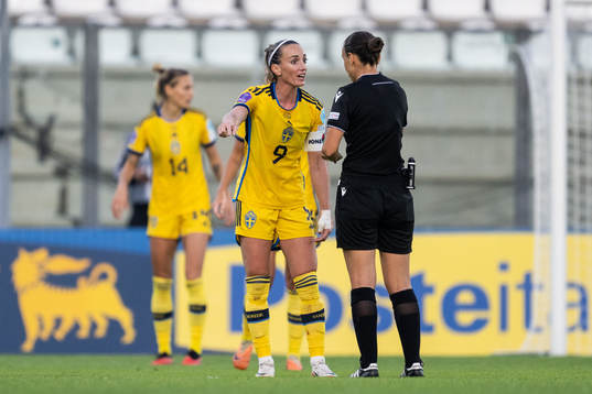 Kosovare Asllani of Sweden in a discussion with referee