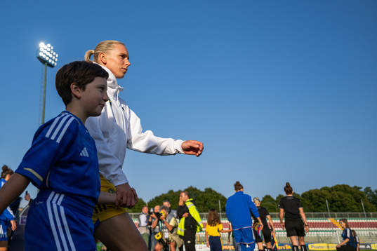 Jonna Andersson of Sweden enter the pitch