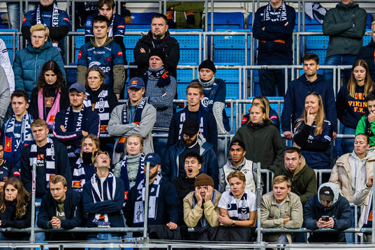 Spectators in the stands looks dejected