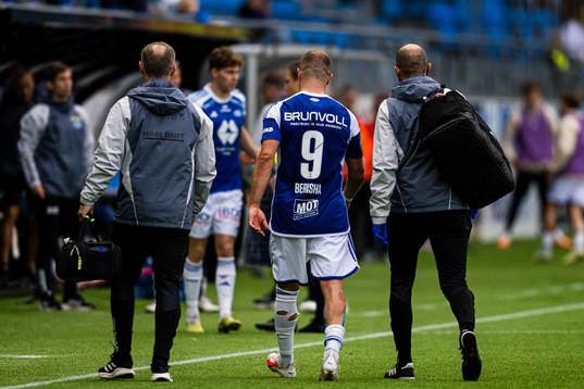 Veton Berisha of Molde walks off the pitch with an injury