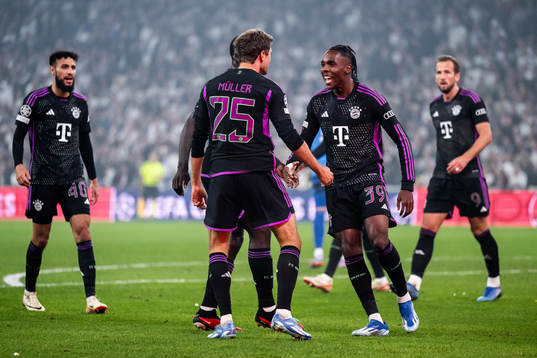Thomas Muller and Mathys Tel of Bayern Munich celebrate