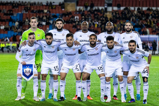 The starting eleven of Qarabag pose for a team group photo