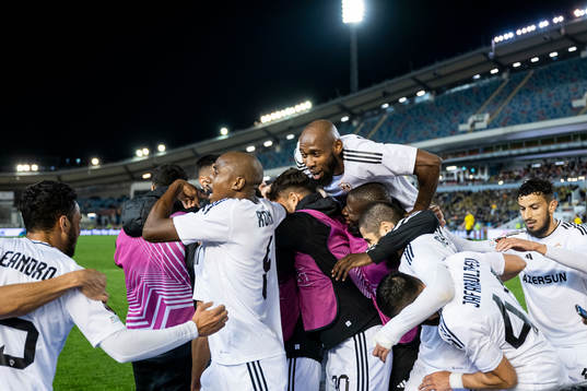 Juninho of Qarabag celebrate with teammates