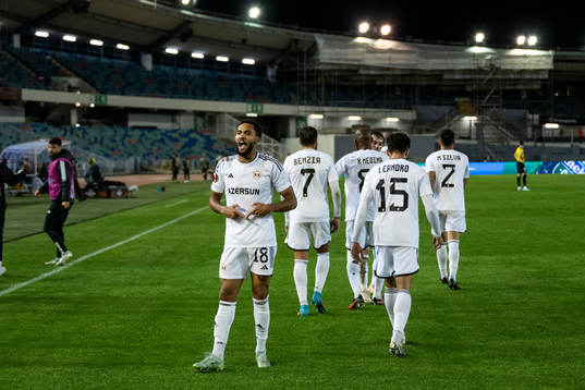 Juninho of Qarabag celebrate with teammates