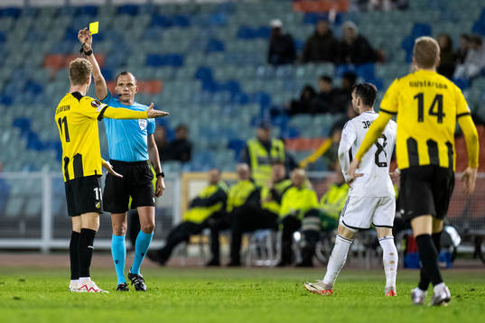 Samuel Gustafson of Häcken receives a warning from referee