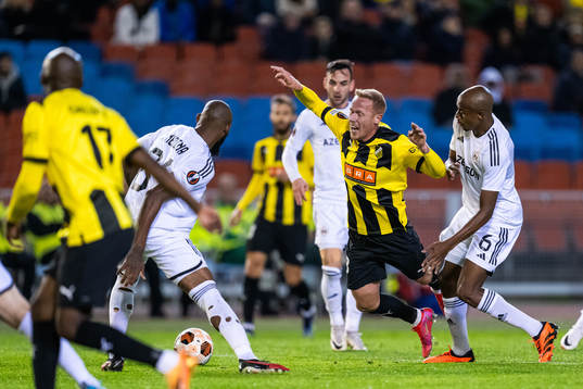 Mikkel Rygaard Jensen of Häcken falls in a duel with Julio