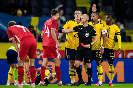 Artur Craciun of Moldova receives a red card