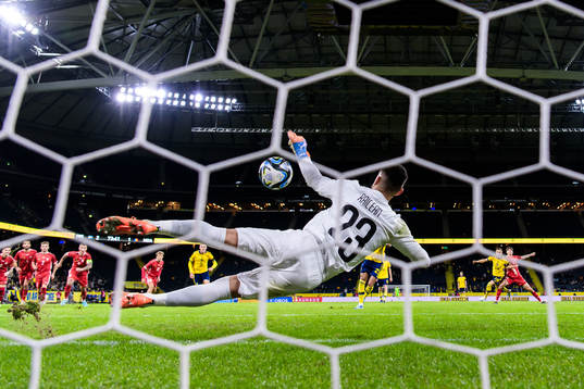 Goalkeeper Dorian Railean of Moldova saves a penalty by