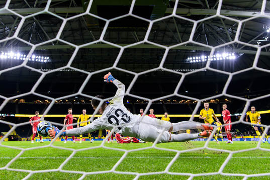 Goalkeeper Dorian Railean of Moldova saves a free kick
