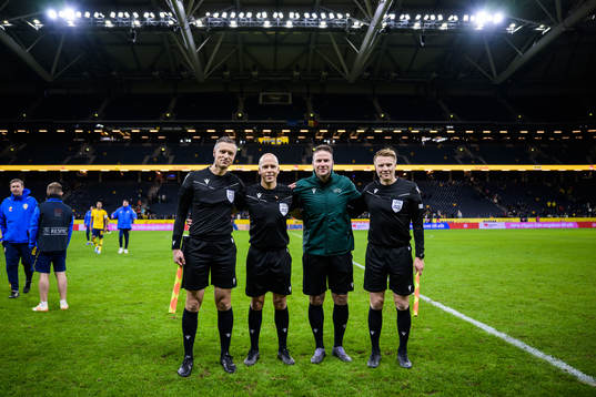 Assistant referee Jukka Honkanen, referee Antti Munukka,