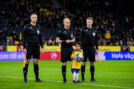 Assistant referee Jukka Honkanen, referee Antti Munukka and