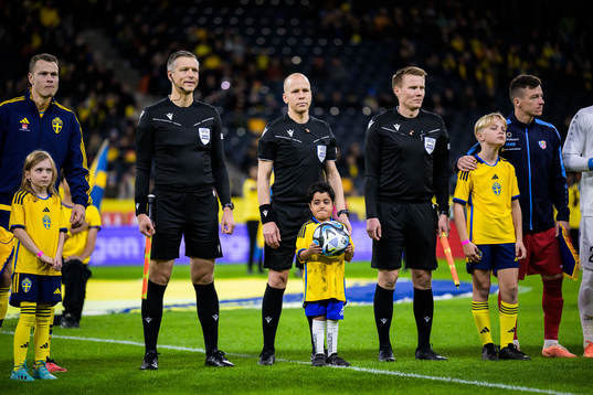 Assistant referee Jukka Honkanen, referee Antti Munukka and