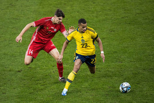 Artur Craciun of Moldova and Robin Quaison of Sweden