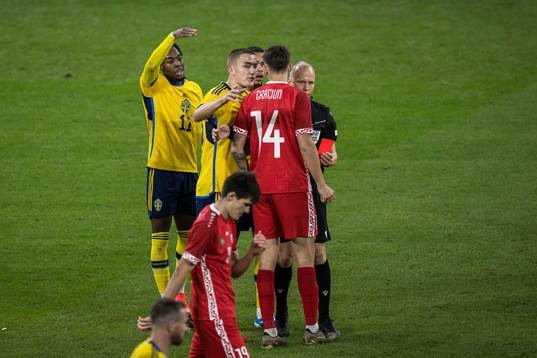 Artur Craciun of Moldova receives a red card from Referee