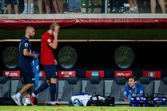 Erling Braut Haaland and goalkeeper Mathias Dyngeland of