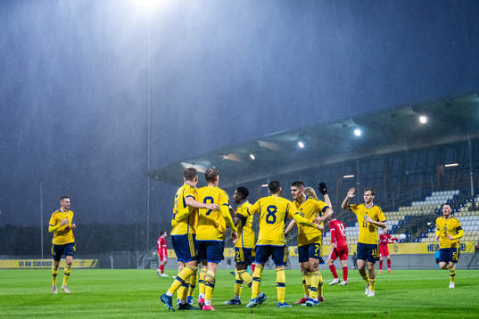 Oscar Wilhelmsson of Sweden celebrates with team mates