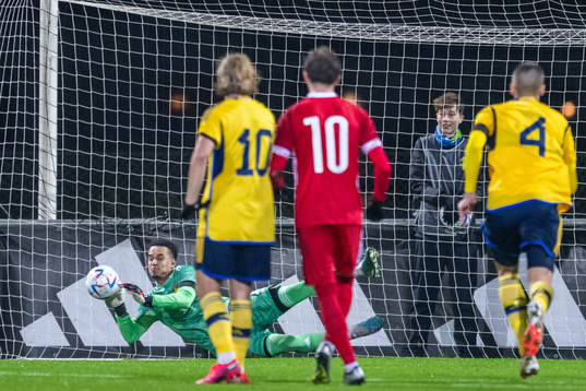 Goalkeeper Oliver Dovin of Sweden saves a penalty from Ion