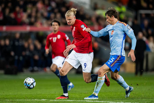 Erling Braut Haaland of Norway and Robin Le Normand of Spain